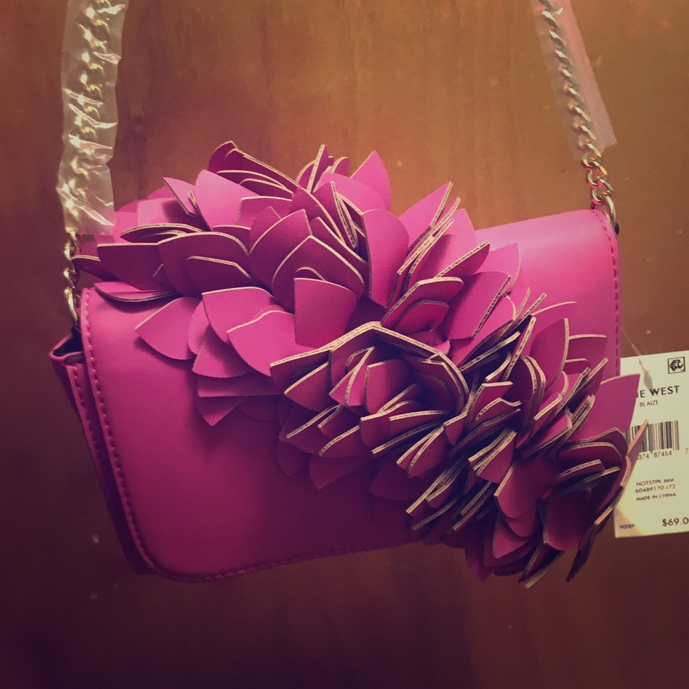 Brand new, never used, pink, Nine West clutch.